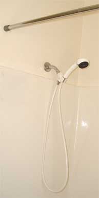Shower with curtain rod.