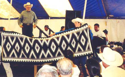 Vášek helps display an Eye Dazzler rug