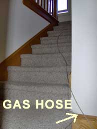 Gas hose to upstairs fan.