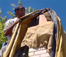 Glenn tends to the chimney.