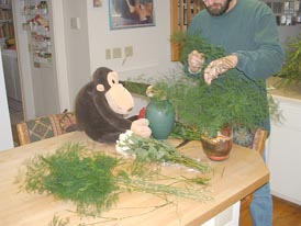 Flower arranging Step 2: Greens go into frog, Ouch!